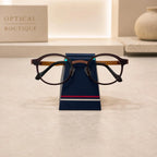 Simple Eyeglass Holder Stand front view — modern trapezoid silhouette in matte navy with red and white racing stripe