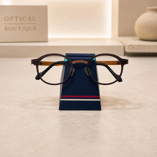 Simple Eyeglass Holder Stand front view — modern trapezoid silhouette in matte navy with red and white racing stripe
